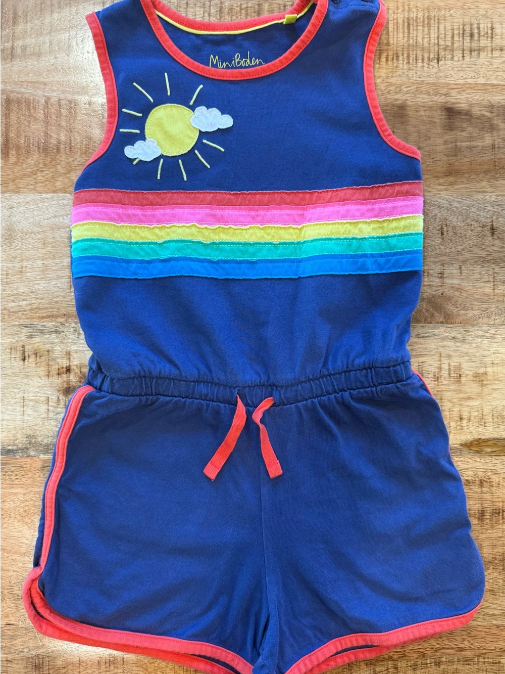 Mini Boden Navy Romper with Rainbow Stripes and Sun Appliqué